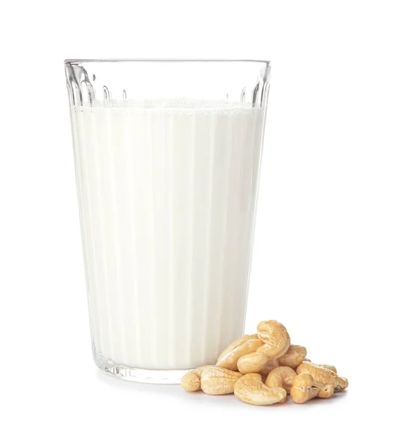 Glass of fresh cashew milk on white background — 스톡 사진