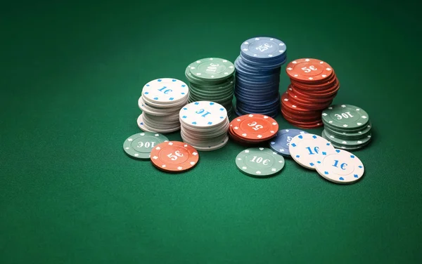 Chips for gambling games on table in casino — Stok fotoğraf