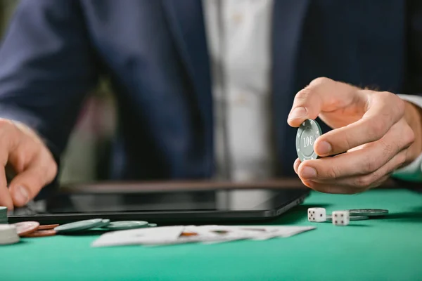 Man with tablet computer playing poker online, closeup — ストック写真