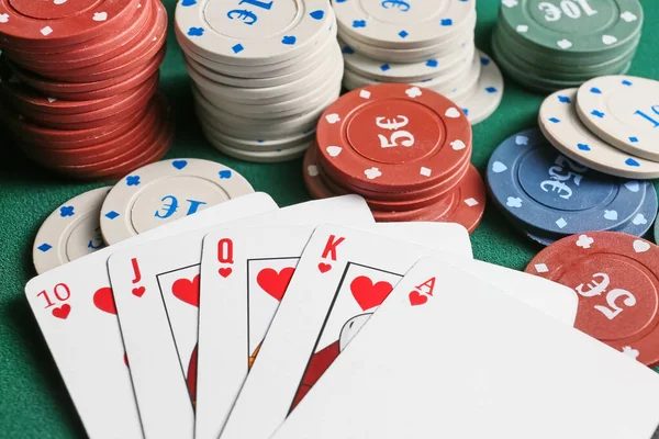 Chips and playing cards for gambling games on table in casino — Stock Photo, Image
