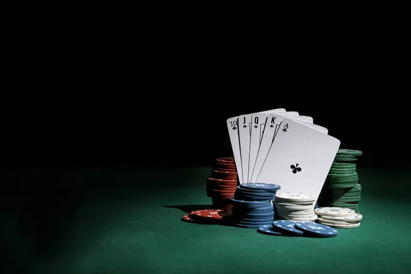 Chips and playing cards for gambling games on table in casino — Stock Photo, Image