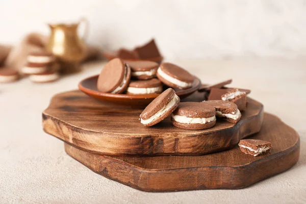 Boards with tasty chocolate cookies on table — Stock Photo, Image