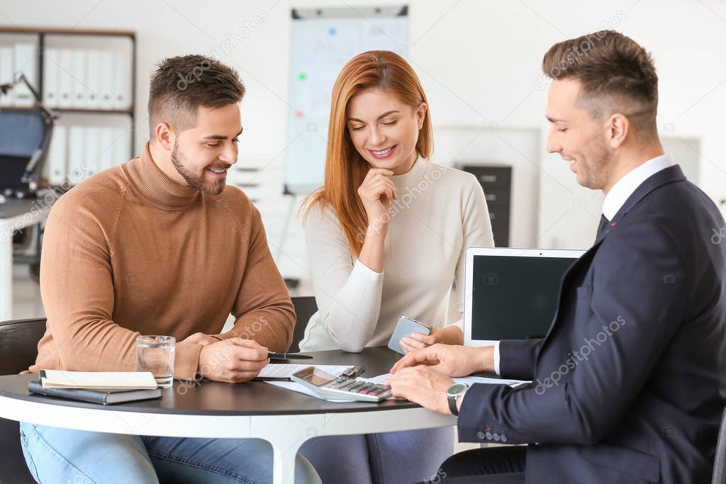 Bank manager working with clients in office