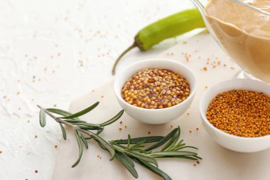 Different tasty sauces on white background