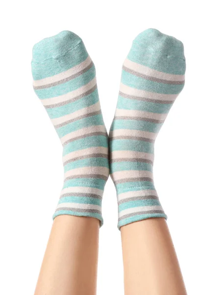 Pernas de mulher jovem em meias no fundo branco — Fotografia de Stock