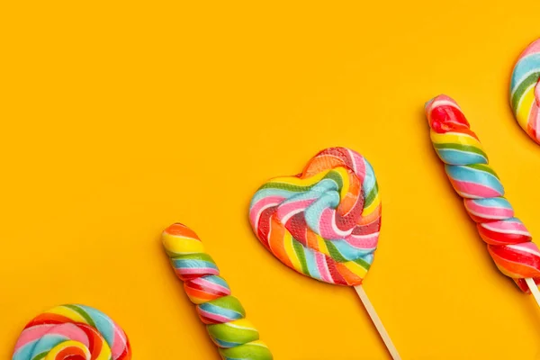 Tasty lollipops on color background — Stock Photo, Image