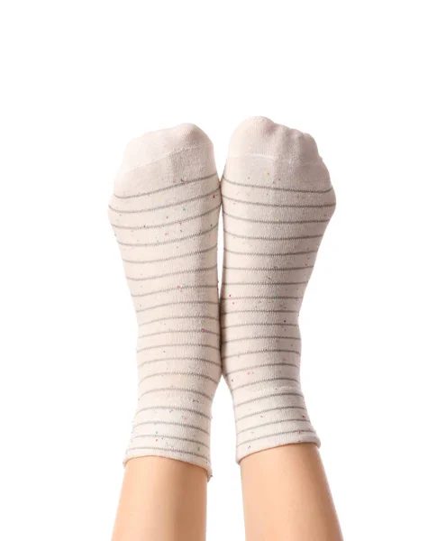 Pernas de mulher jovem em meias no fundo branco — Fotografia de Stock