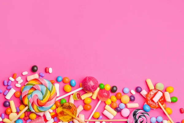 Assortment of tasty candies on color background — Stock Photo, Image