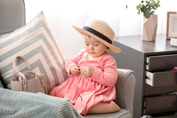 Cute baby girl with stylish accessories at home — Stock Photo, Image