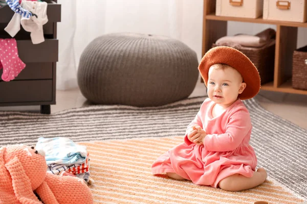 Cute baby with stylish hat at home — Stock Photo, Image