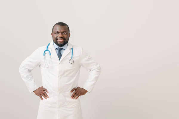 African-American doctor on light background — Stock Photo, Image