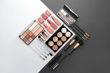 Set of decorative cosmetics on black and white background