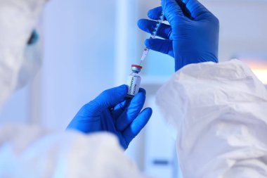 Scientist with vaccine from Corona virus in laboratory