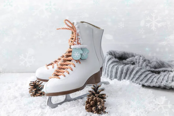 Ice skates and snow on white background — Stock Photo, Image