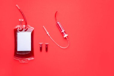 Blood pack for transfusion, test tubes and catheter on color background
