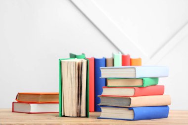 Many books on table indoors