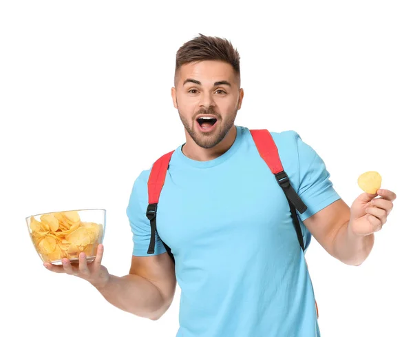 Guapo estudiante masculino con sabrosas papas fritas sobre fondo blanco —  Fotos de Stock