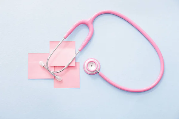 Stethoscope with paper sheets on white background. Cardiology concept — Stock Photo, Image