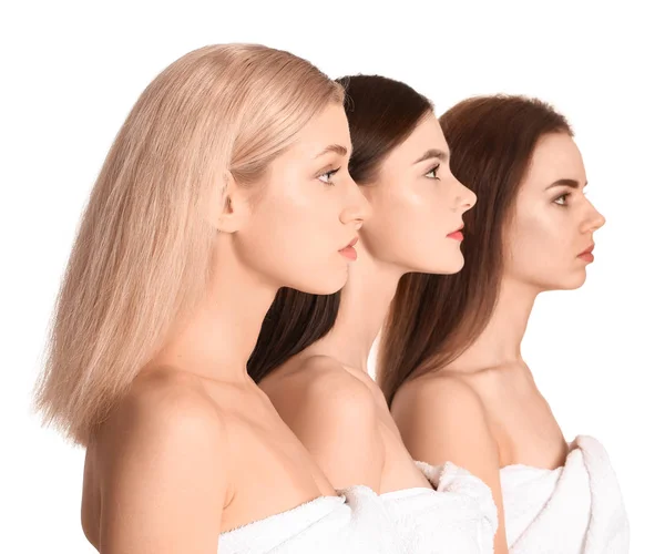 Mladé ženy s krásným make-upem na bílém pozadí — Stock fotografie