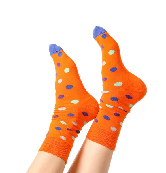 Beine der jungen Frau in Socken auf weißem Hintergrund — Stockfoto