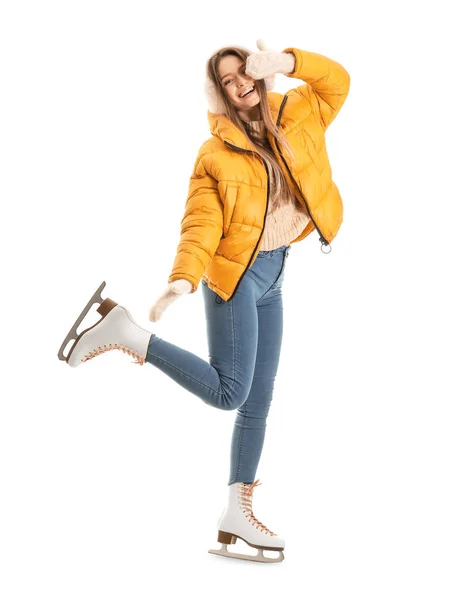 Beautiful young woman on ice skates against white background — Stock Photo, Image