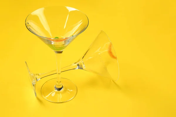 Dirty empty cocktail glasses on color background — Stock Photo, Image