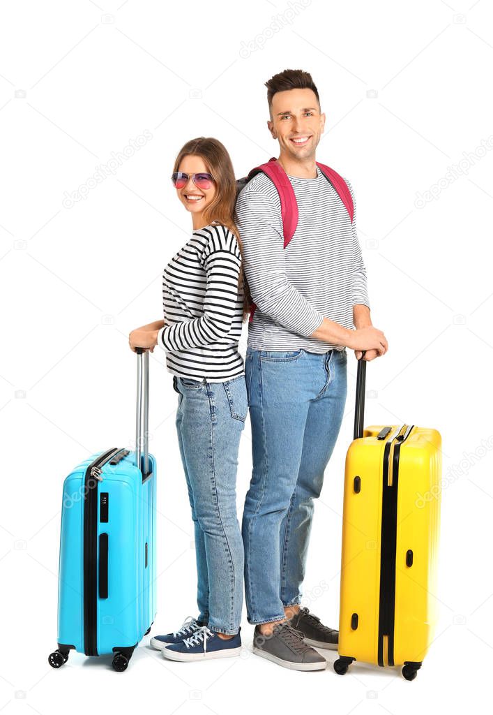 Couple of tourists with luggage on white background