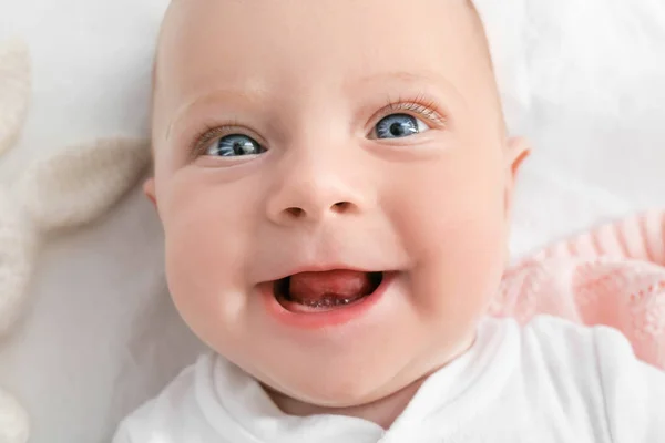 Portrait of cute little baby lying on bed, closeup — Stock Photo, Image