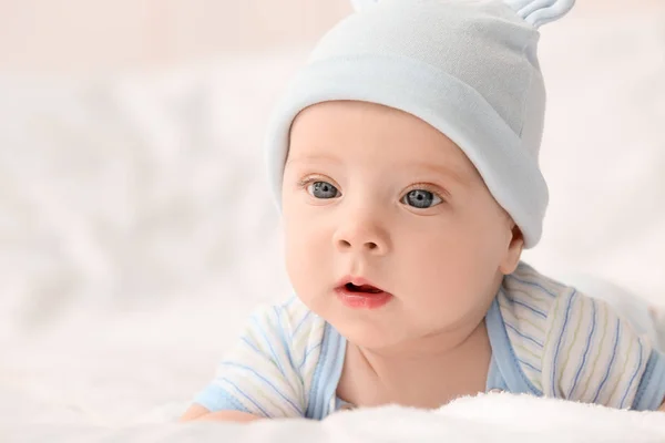 Portrait of cute little baby lying on bed — Stock Photo, Image