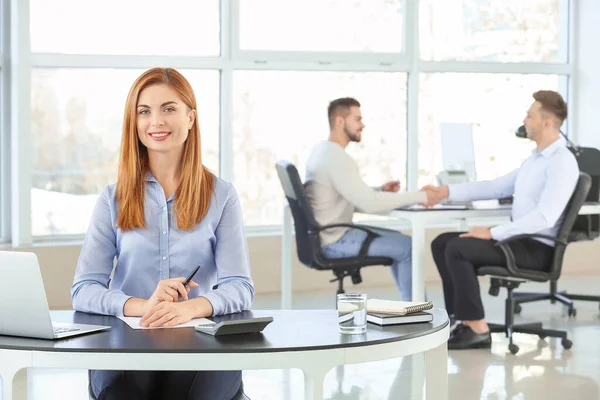 Portrait of bank manager working in office