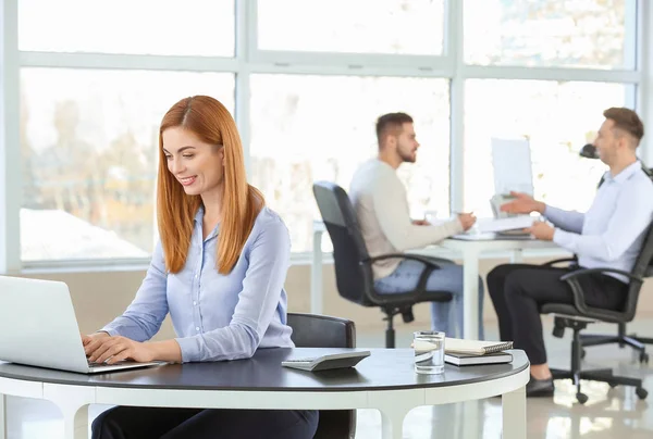 Portrait of bank manager working in office