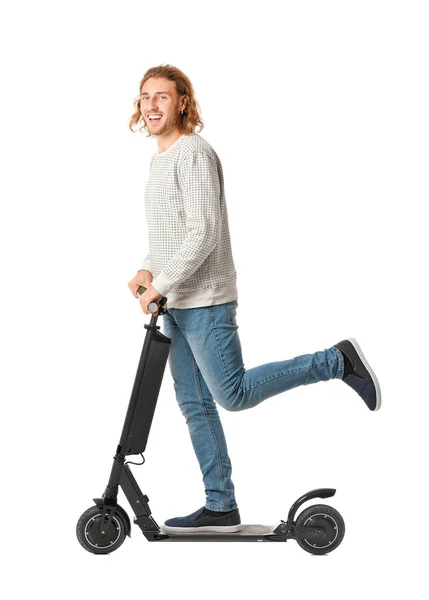 Young man with kick scooter on white background — Stok fotoğraf