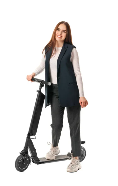 Young woman with kick scooter on white background — 스톡 사진