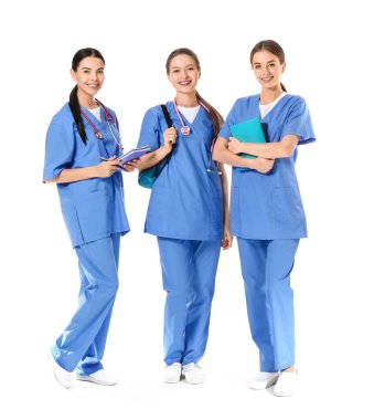 Female medical students on white background
