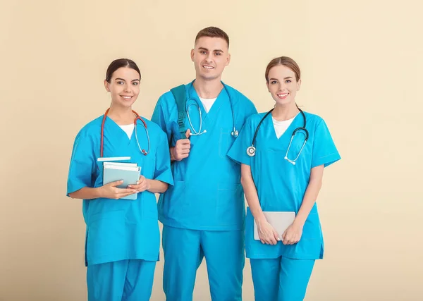 Group of medical students on light background — Stock Photo, Image