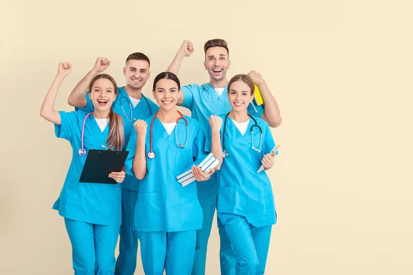 Group of happy medical students on light background — 스톡 사진