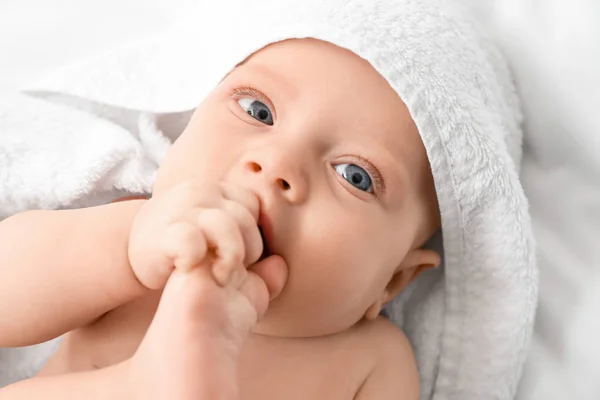 Portrait of cute little baby with towel — Stok fotoğraf