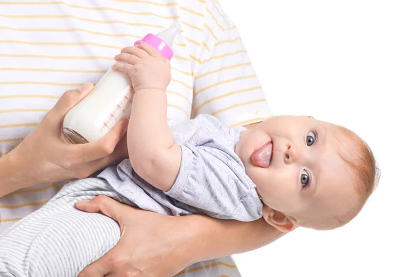 Mother feeding baby with milk from bottle on white background — Stock Photo, Image