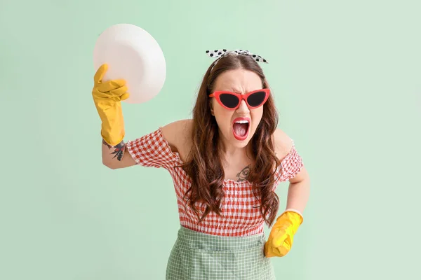 Funny housewife on color background — Stock Photo, Image