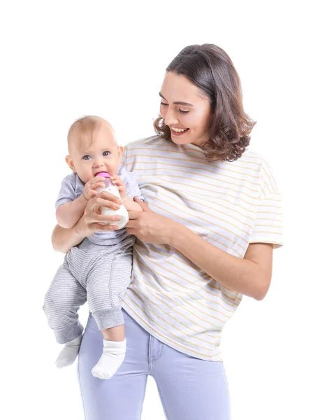 Mother feeding baby with milk from bottle on white background — Stok fotoğraf