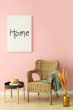 Interior of modern room with comfortable armchair near color wall