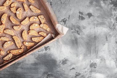 Tray with sweet almond cookies on table