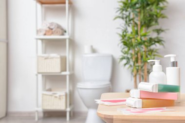 Liposoluble wax cartridges with strips on table in bathroom