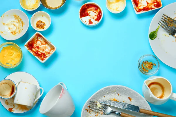 Frame made of dirty empty dishes on color background — Stock Photo, Image