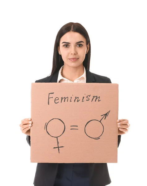 Jonge zakenvrouw met karton met symbolen van man en vrouw op witte achtergrond. Begrip feminisme — Stockfoto