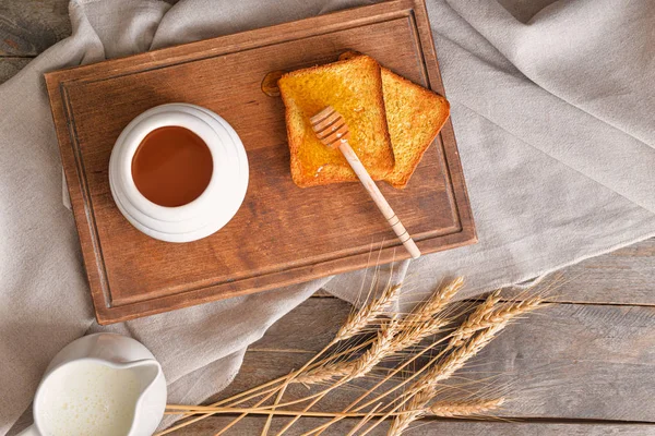Sweet honey, milk and toasted bread on table — 스톡 사진