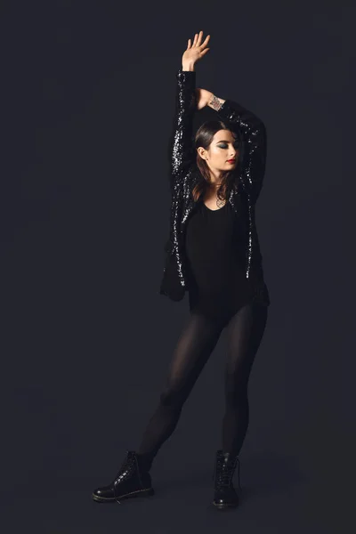 Beautiful fashionable woman on dark background — Stock Photo, Image