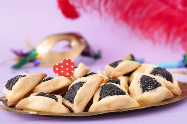 Tray with tasty hamantaschen for Purim holiday on color background — Stock Photo, Image