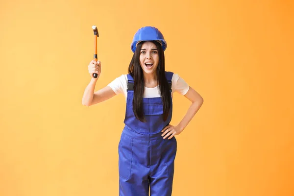 Female worker against color background. Concept of feminism — Stock Photo, Image