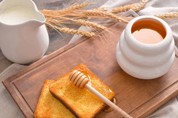 Sweet honey, milk and toasted bread on table — 스톡 사진